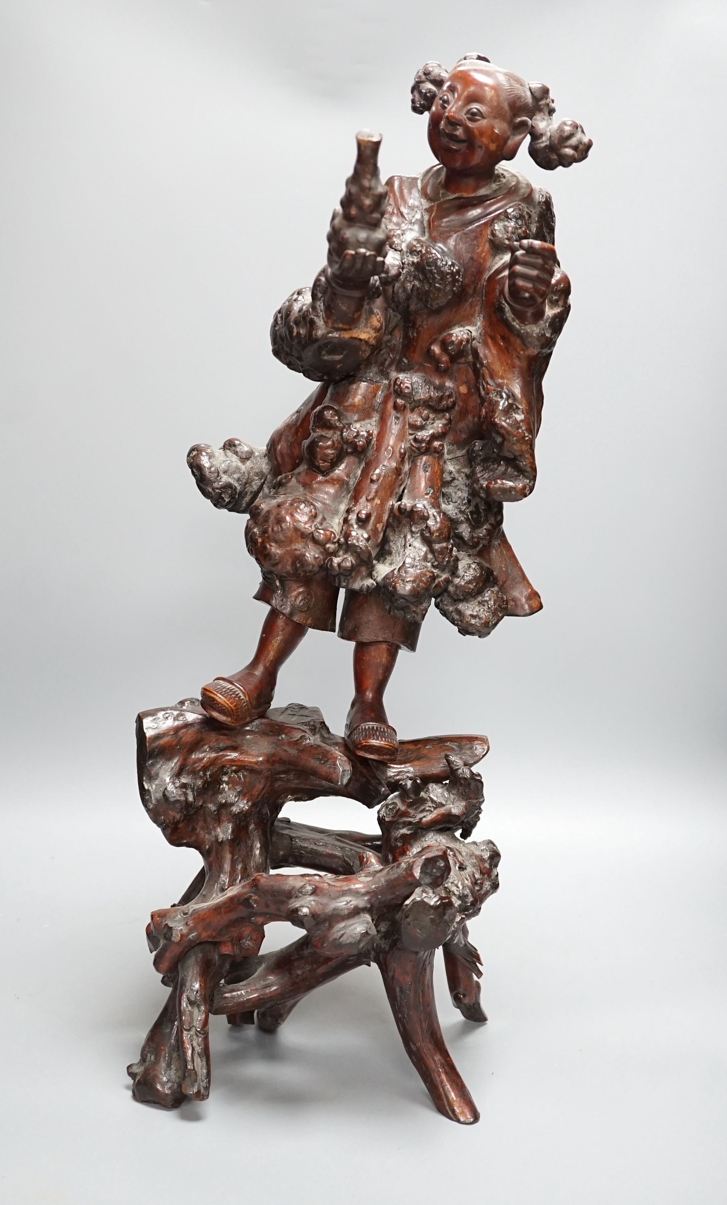 A Chinese root carving of a lady, 57cm